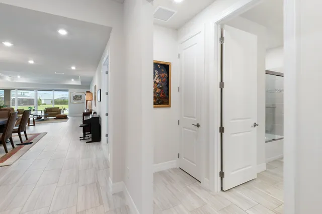 a bathroom with a double vanity sink and a toilet