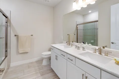 a view of a bathroom from a hallway