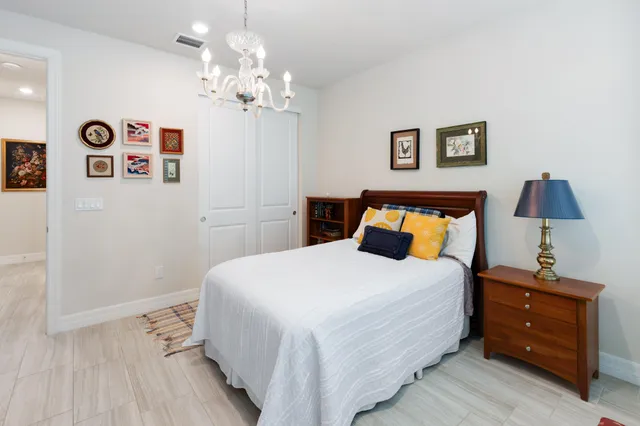 a bedroom with a bed and a workspace