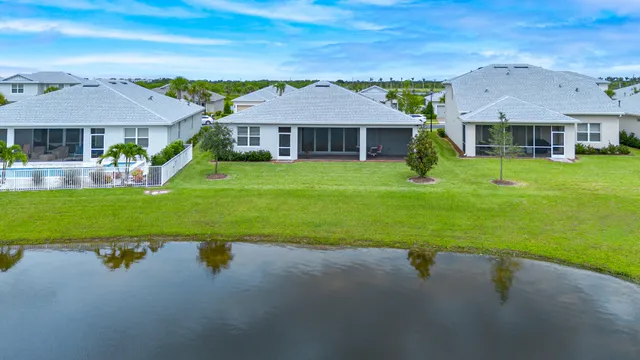 an aerial view of a house a yard and outdoor seating