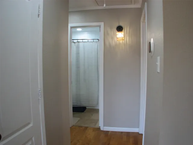 a view of a hallway with front door