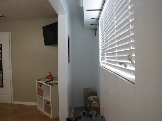 a view of a livingroom with storage and utility