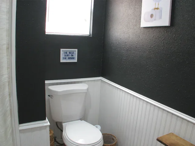 a bathroom with a toilet