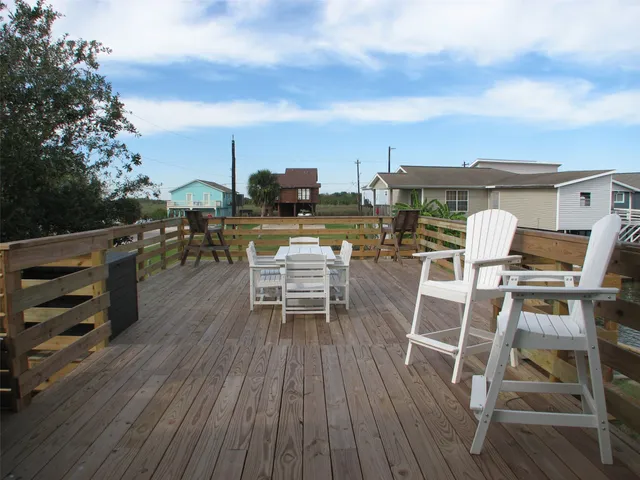 a view of a chairs with a table and chairs in the patio