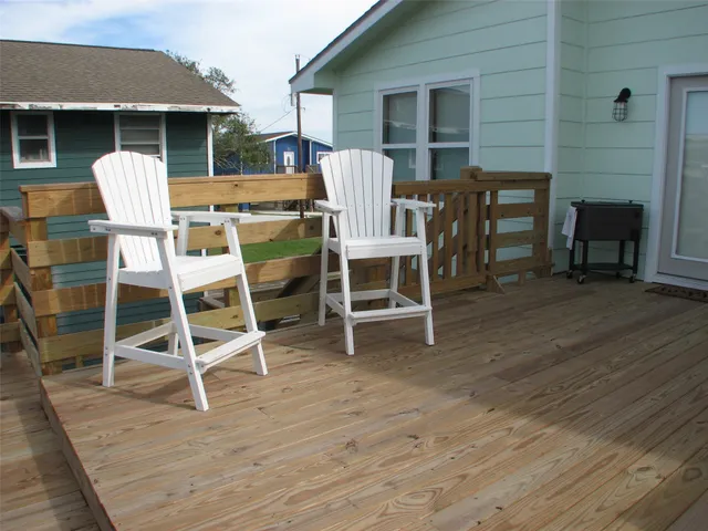 a patio with table and chairs