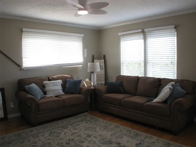 a living room with furniture and a window