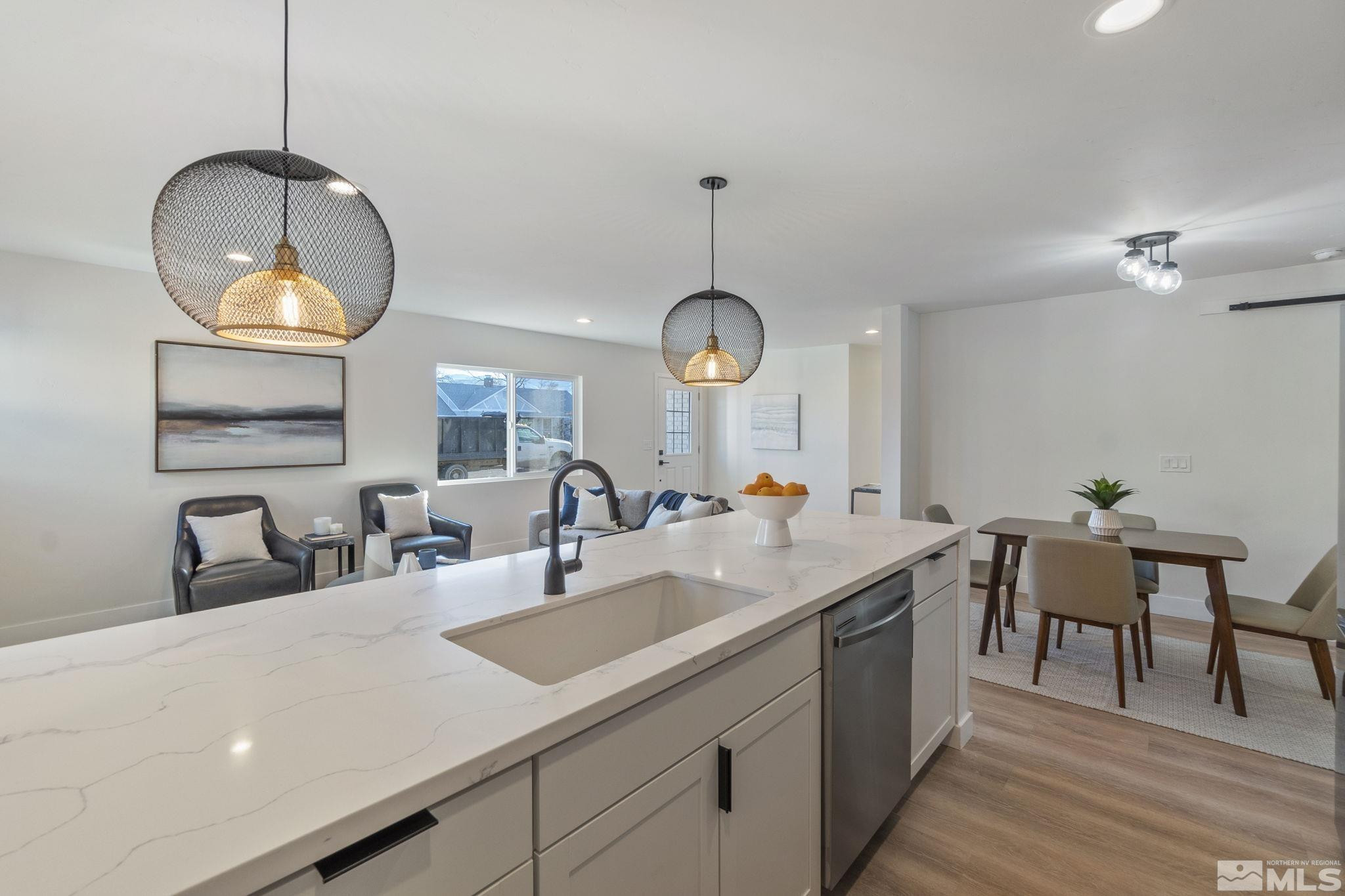 711 Balzar Circle Reno, NV 89502 - Photo 9 of 35 a kitchen with sink and chandelier