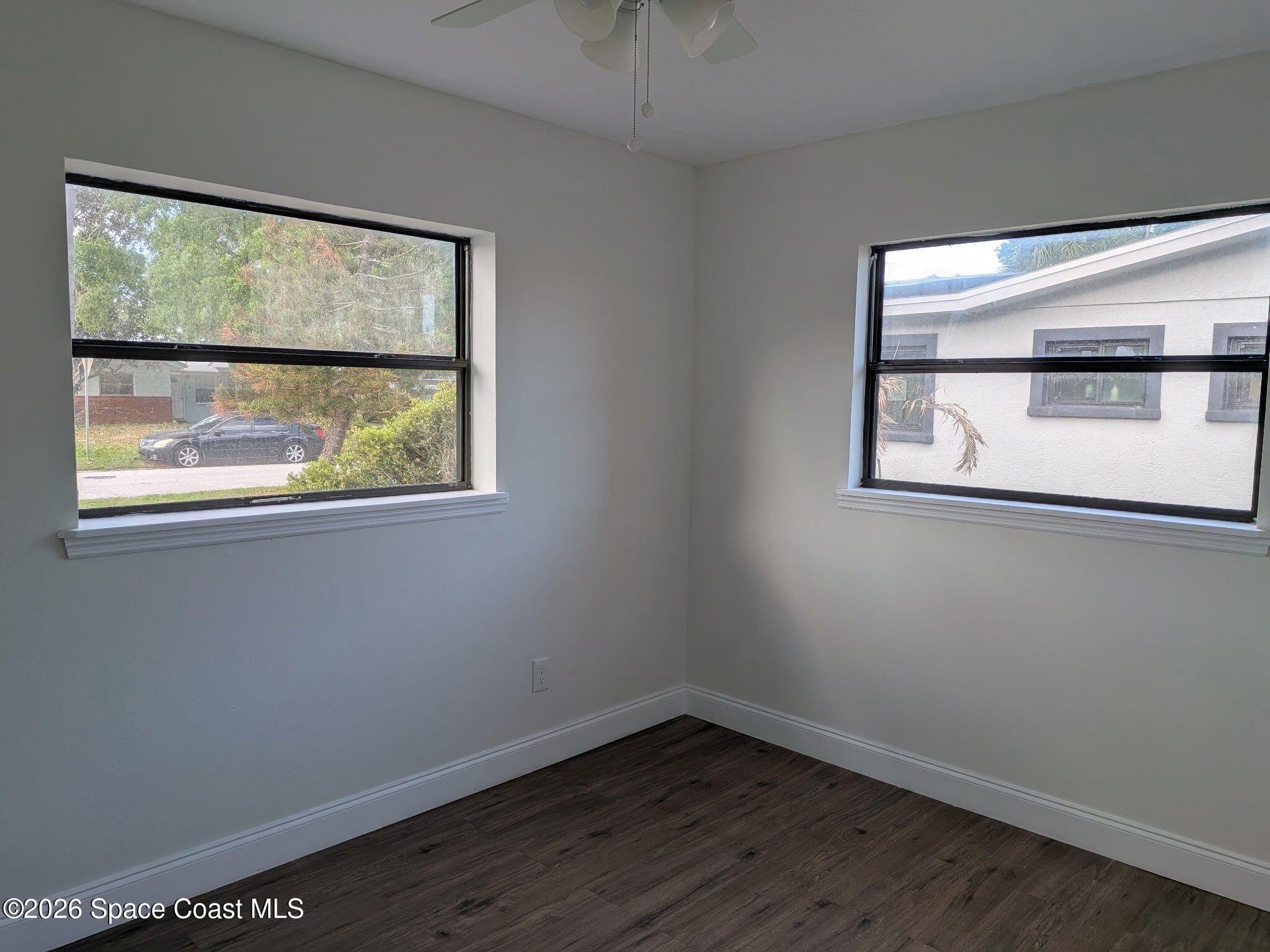 999 Cardon Drive Rockledge, FL 32955 - Photo 5 of 8 an empty room with a window