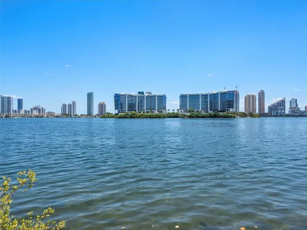 a view of a ocean with tall building