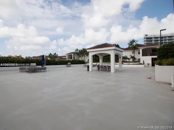 a view of house with outdoor space and lakeside