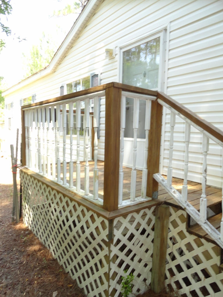 339 East Nursery Road Santa Rosa Beach, FL 32459 - Photo 2 of 32 a view of a porch with wooden floor