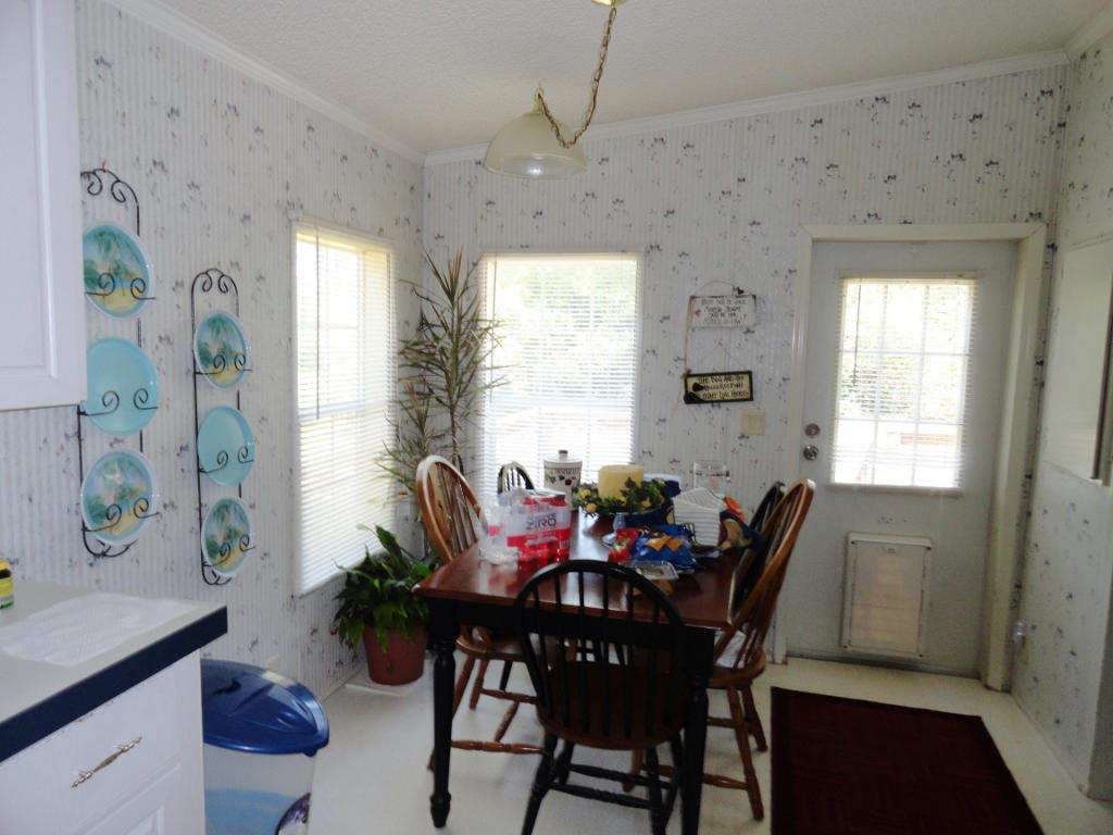 339 East Nursery Road Santa Rosa Beach, FL 32459 - Photo 11 of 32 a view of a dining room with furniture and window