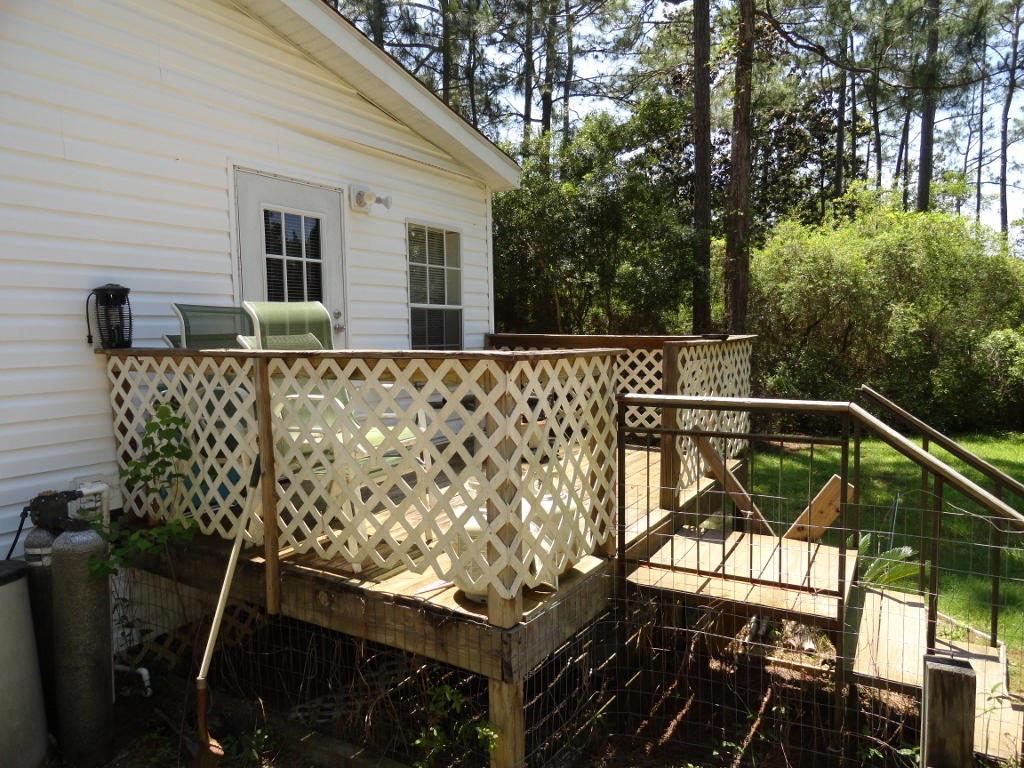 339 East Nursery Road Santa Rosa Beach, FL 32459 - Photo 12 of 32 a view of a balcony with chairs