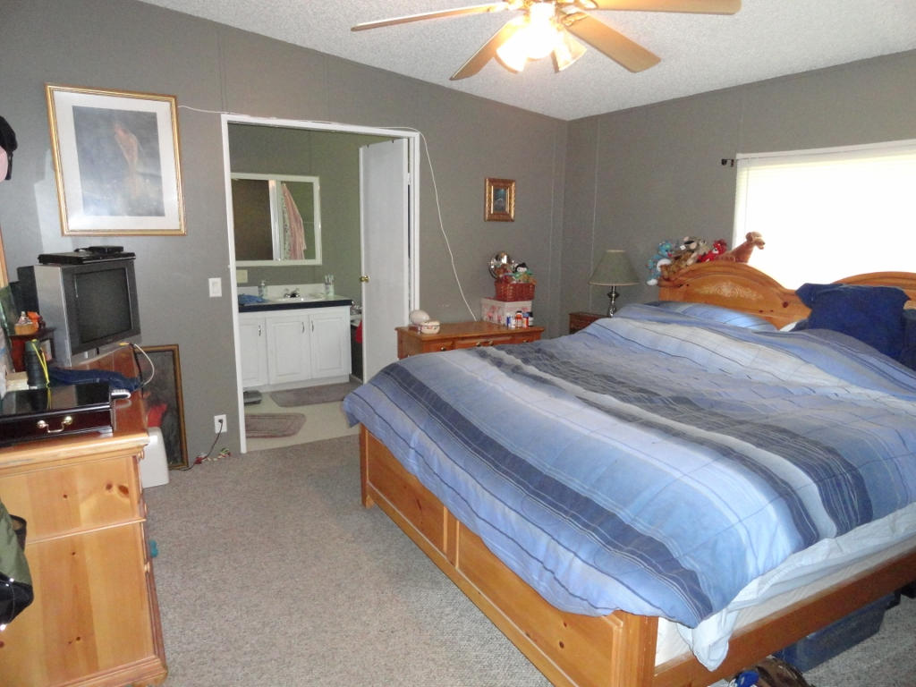 339 East Nursery Road Santa Rosa Beach, FL 32459 - Photo 16 of 32 a bedroom with a bed and wooden floor