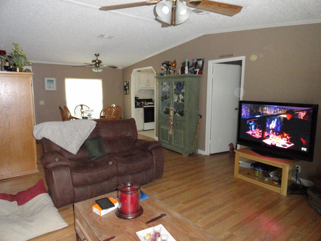 339 East Nursery Road Santa Rosa Beach, FL 32459 - Photo 5 of 32 a living room with furniture and a flat screen tv