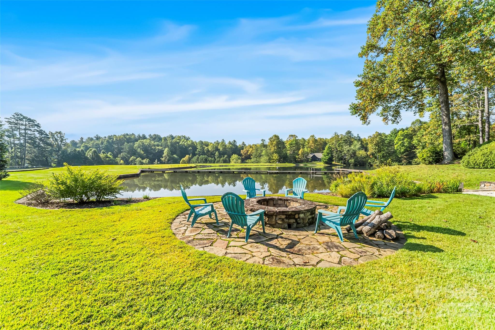 L12 R TrailSide Court Brevard, NC 28712 - Photo 10 of 13 a view of a lake with a table and chairs