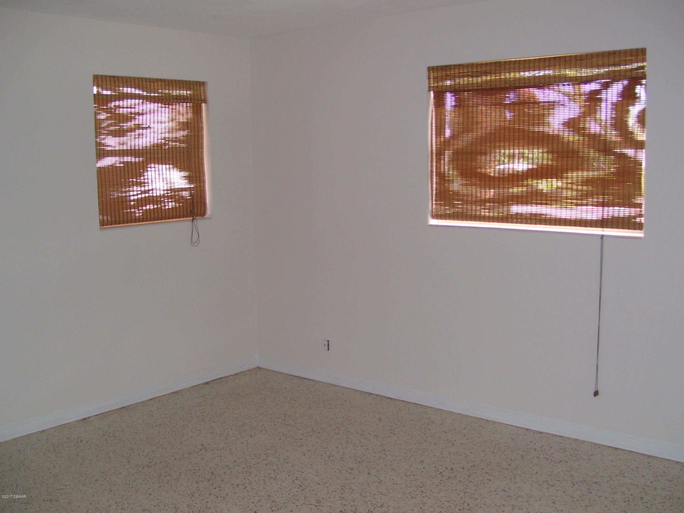 61 Rivocean Drive Ormond Beach, FL 32176 - Photo 11 of 23 an empty room with a window