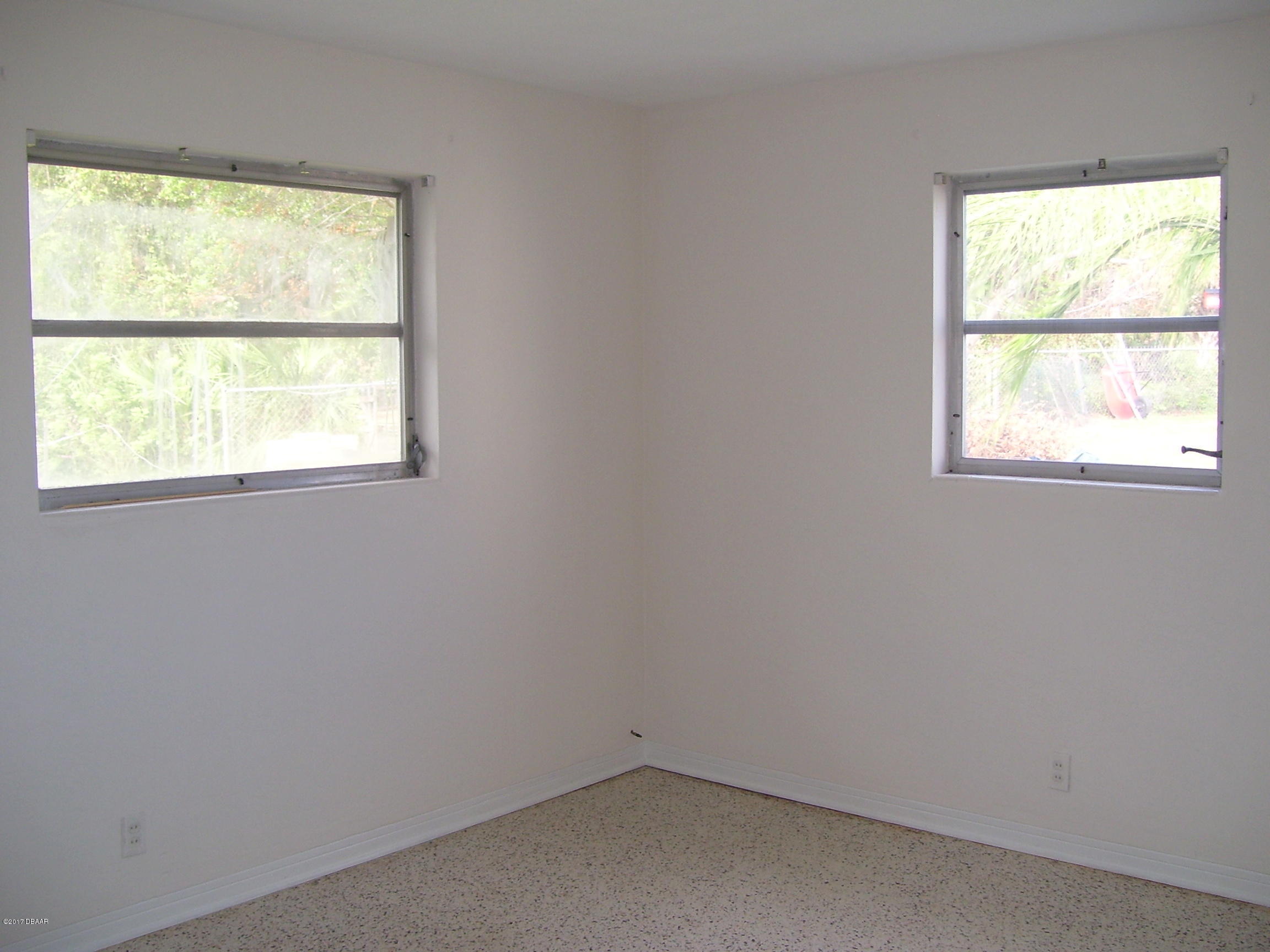 61 Rivocean Drive Ormond Beach, FL 32176 - Photo 13 of 23 an empty room with a window