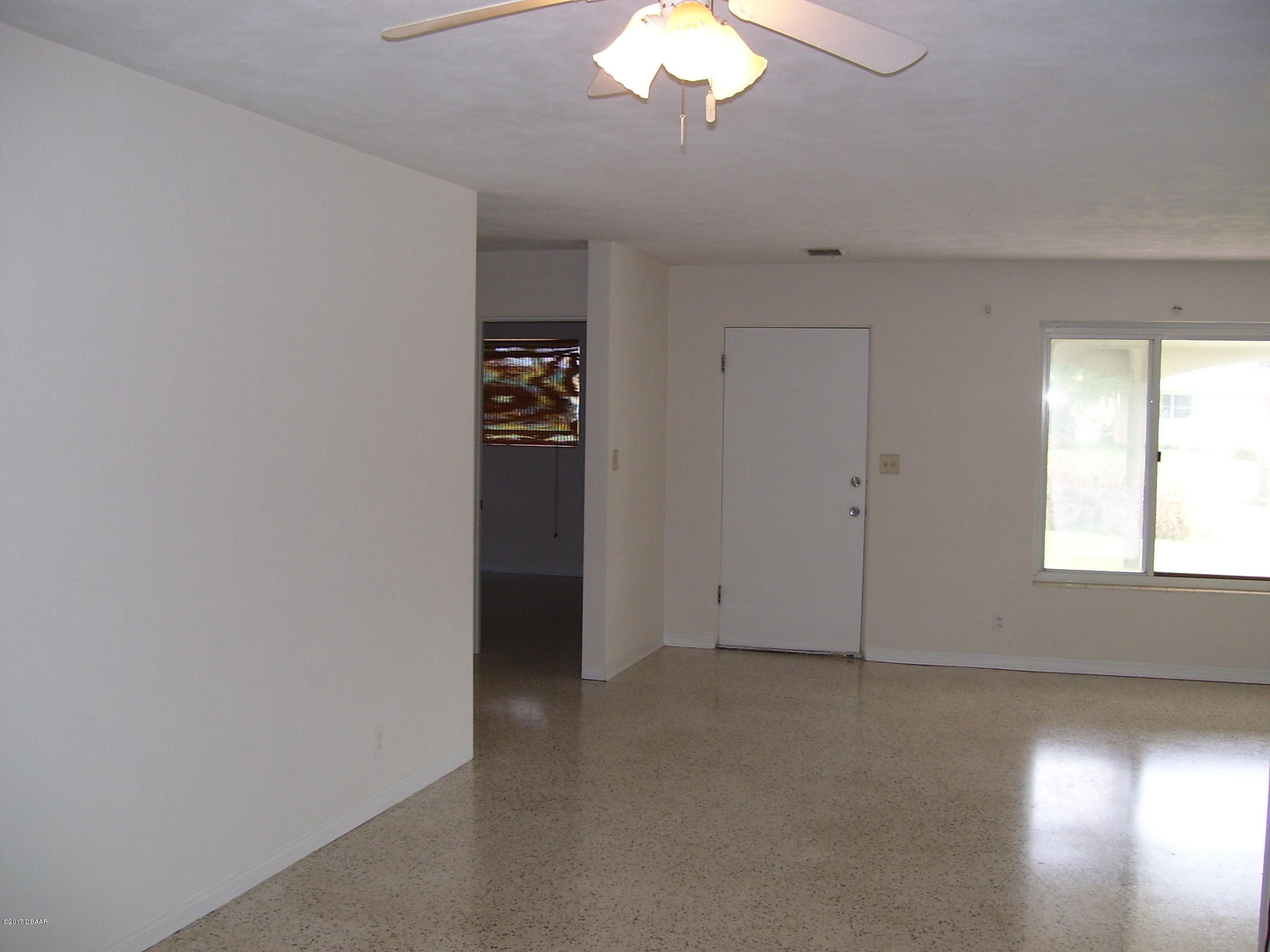 61 Rivocean Drive Ormond Beach, FL 32176 - Photo 2 of 23 an empty room with a empty space and a window