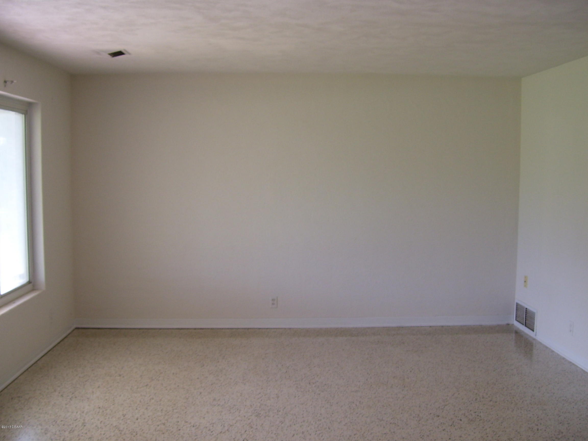 61 Rivocean Drive Ormond Beach, FL 32176 - Photo 3 of 23 a view of an empty room and window