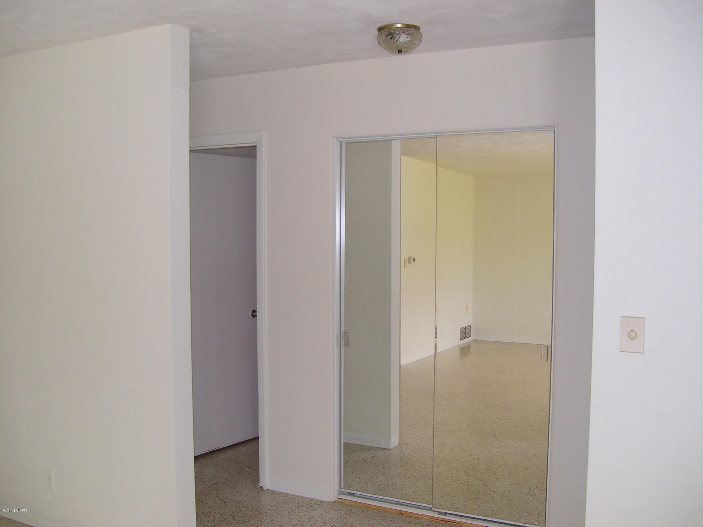 61 Rivocean Drive Ormond Beach, FL 32176 - Photo 7 of 23 a bathroom with a glass shower door