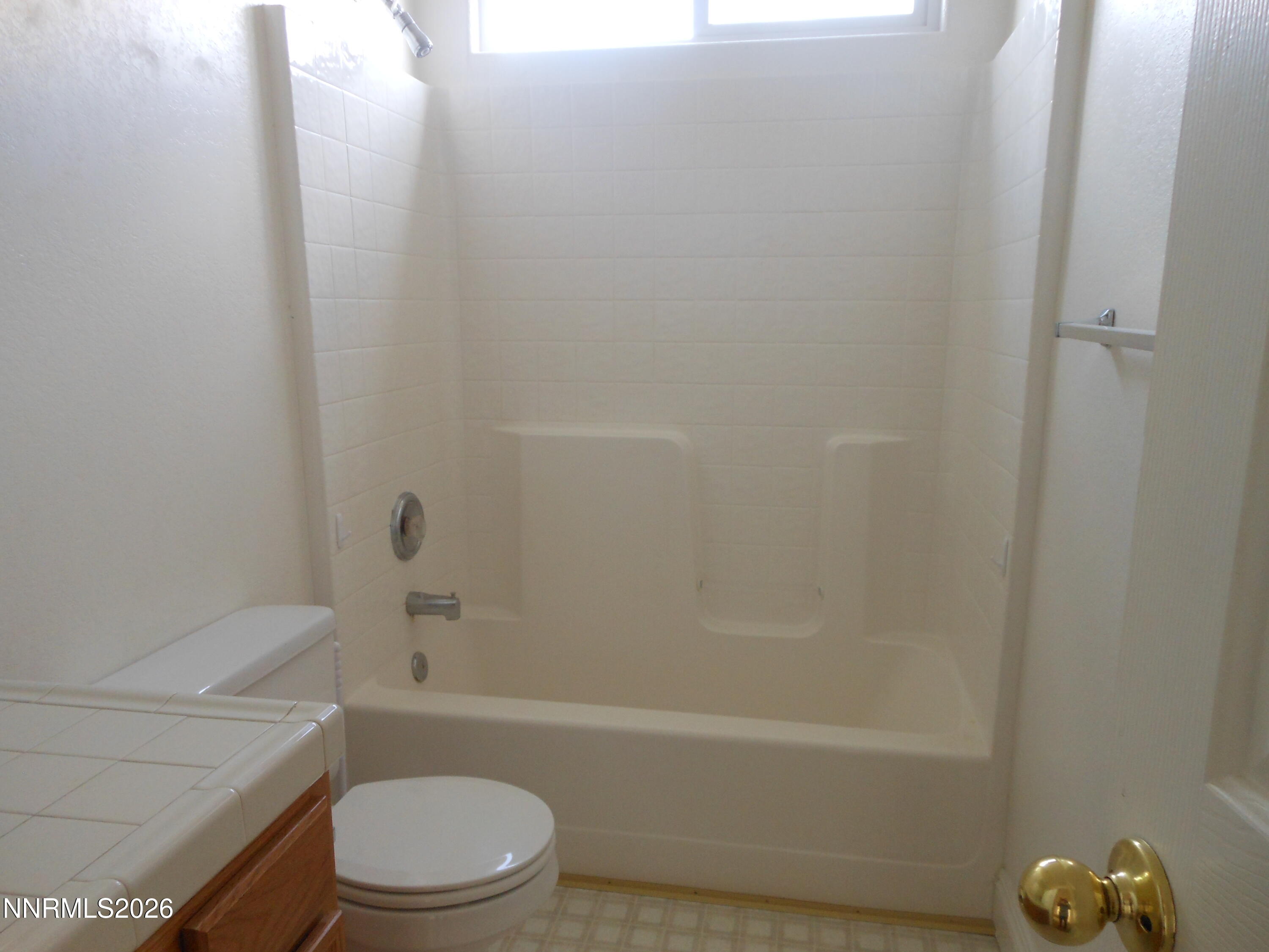 170 Winchester Road Fallon, NV 89406 - Photo 11 of 13 a bathroom with a toilet and a bath tub