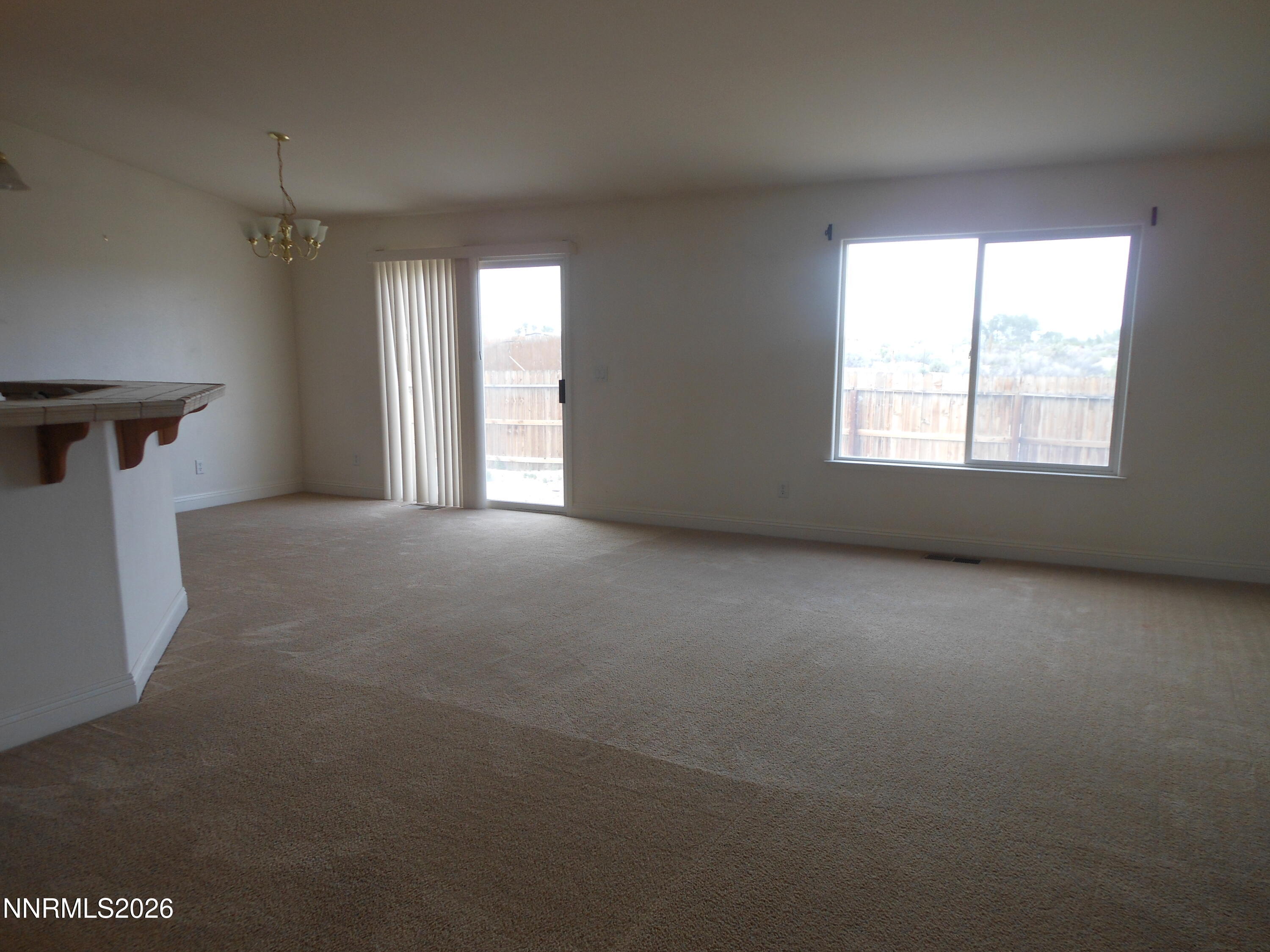 170 Winchester Road Fallon, NV 89406 - Photo 5 of 13 a view of an empty room with a window