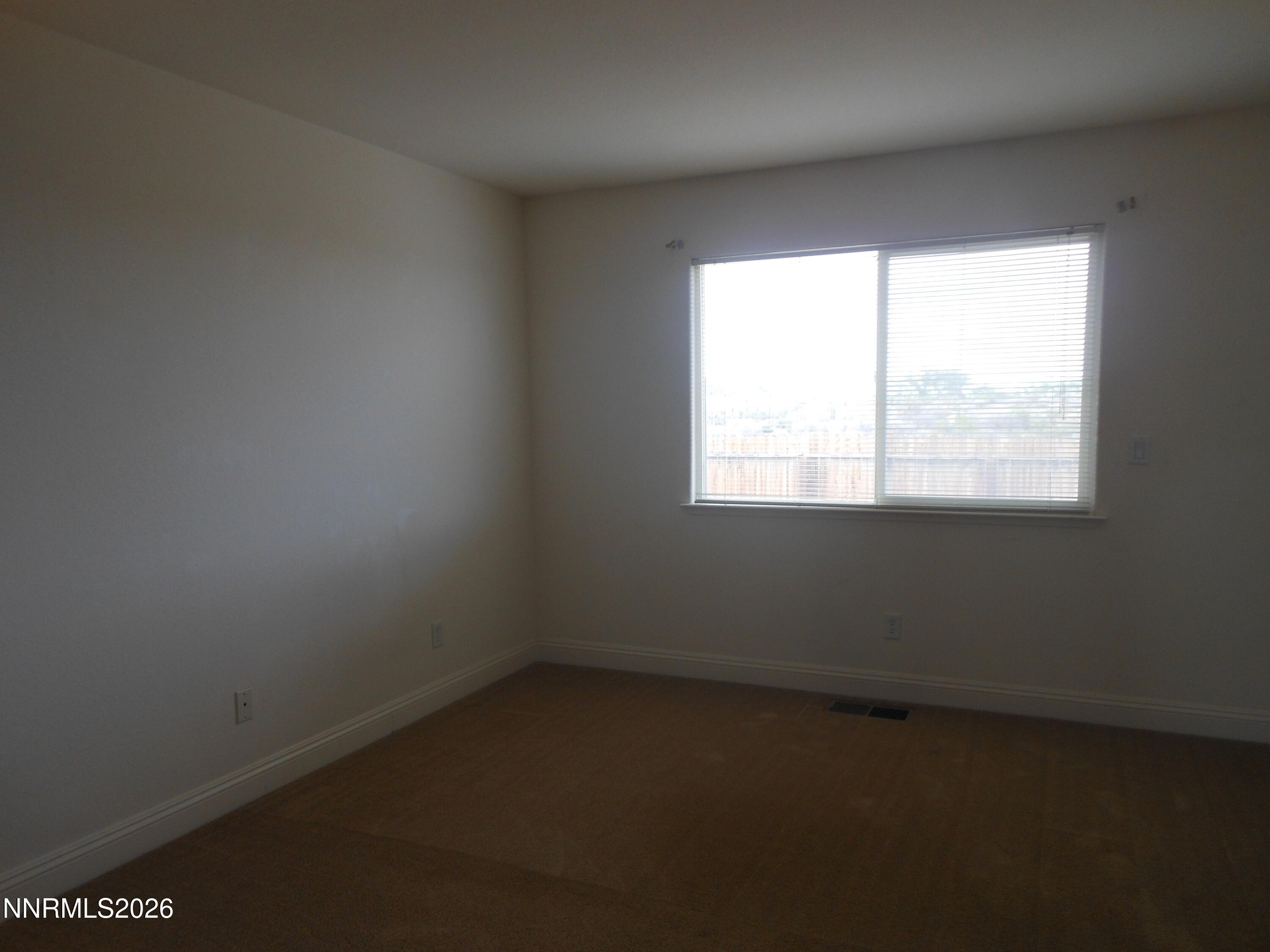 170 Winchester Road Fallon, NV 89406 - Photo 6 of 13 an empty room with a window