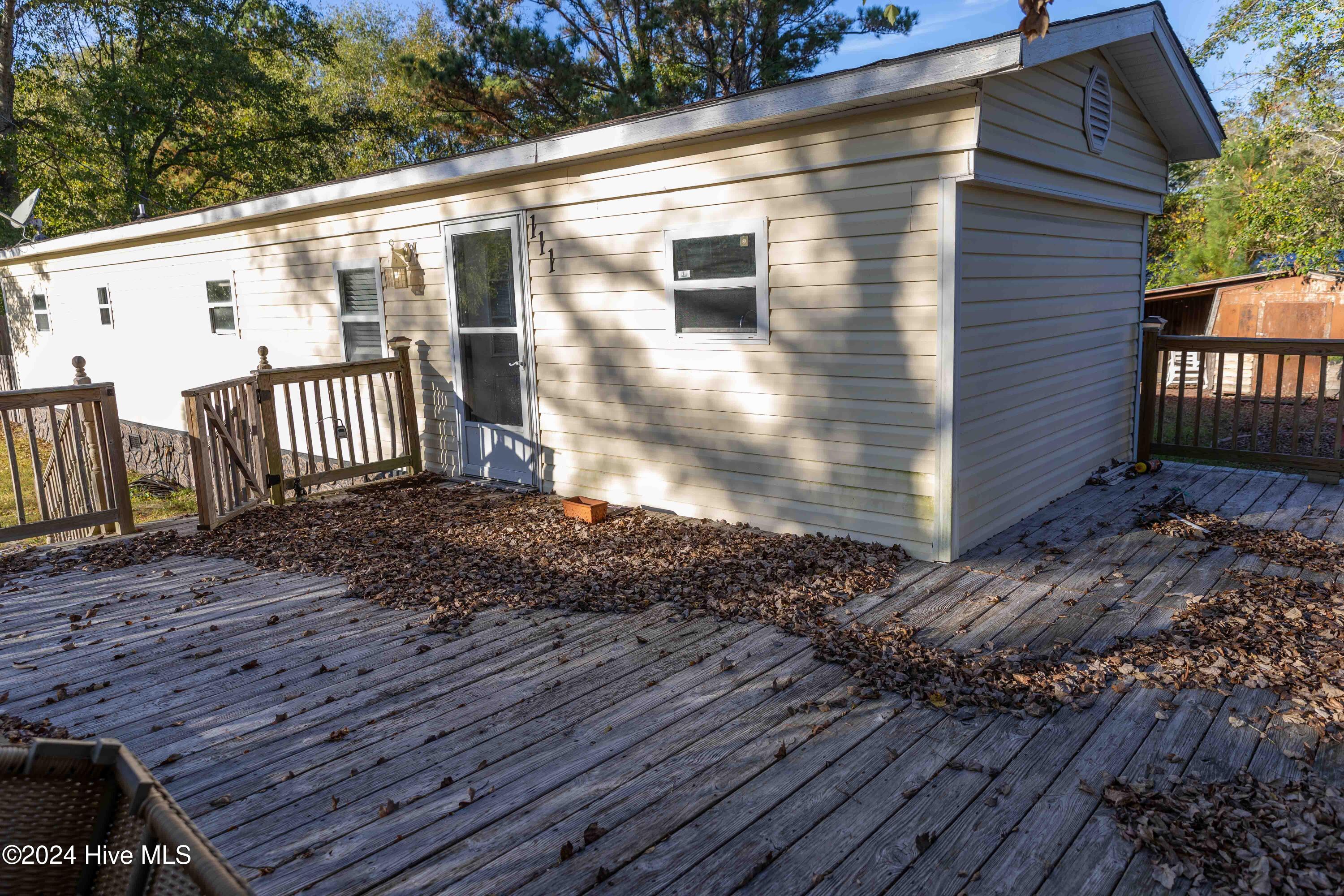 111 Boyle Drive Hampstead, NC 28443 - Photo 3 of 23 Front of house & deck