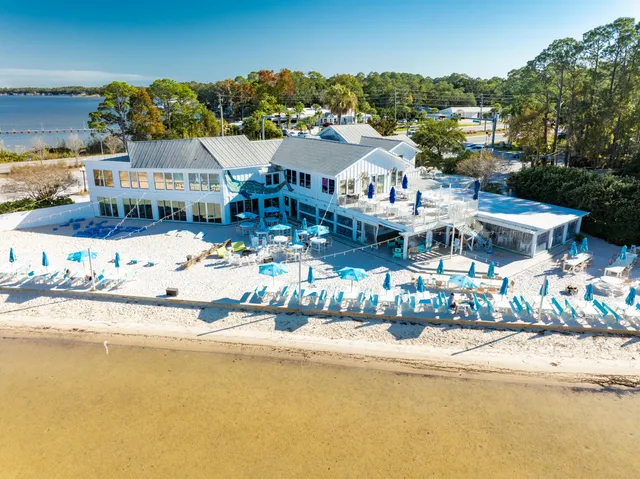 a swimming pool view with a outdoor seating space