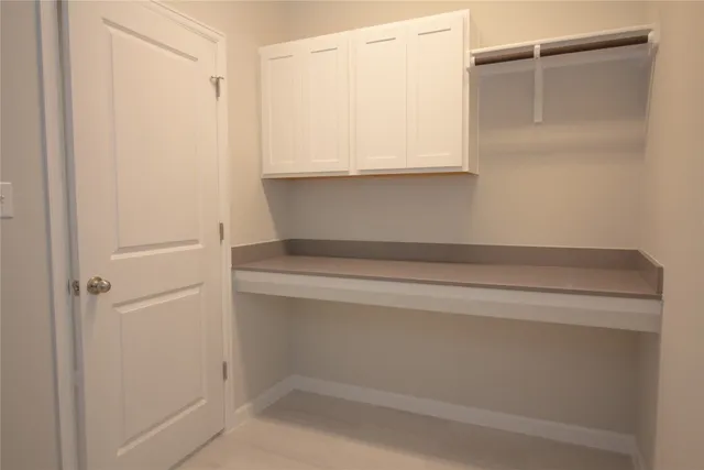 a large kitchen with stainless steel appliances granite countertop a stove a sink and a microwave