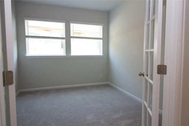 a view of a hallway with seating area