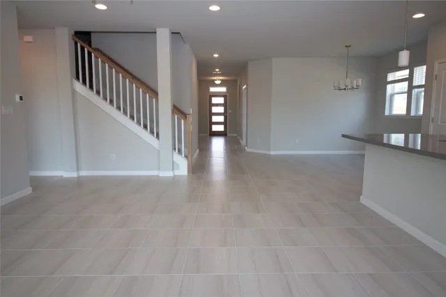 a kitchen with kitchen island a sink and a counter top space