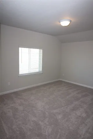 a kitchen with kitchen island granite countertop a sink a counter space appliances and cabinets