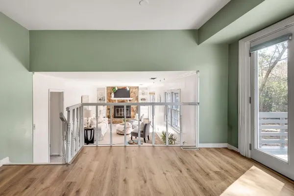 a living room with fireplace furniture and a window