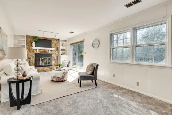 a living room with furniture and a large window
