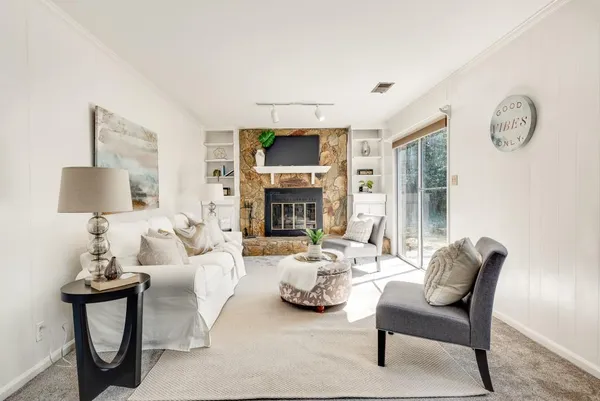 a living room with furniture and a large window
