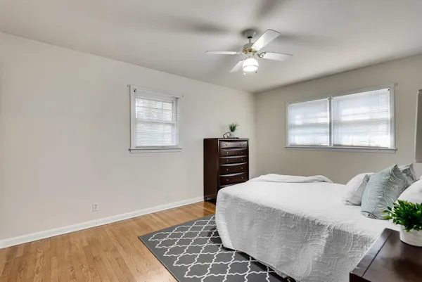 a bedroom with a bed and a dresser