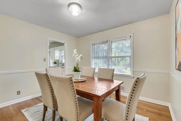 a kitchen with stainless steel appliances granite countertop a refrigerator a stove top oven a sink and dishwasher