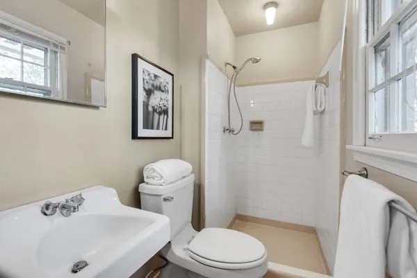 an empty room with a fan and a ceiling fan