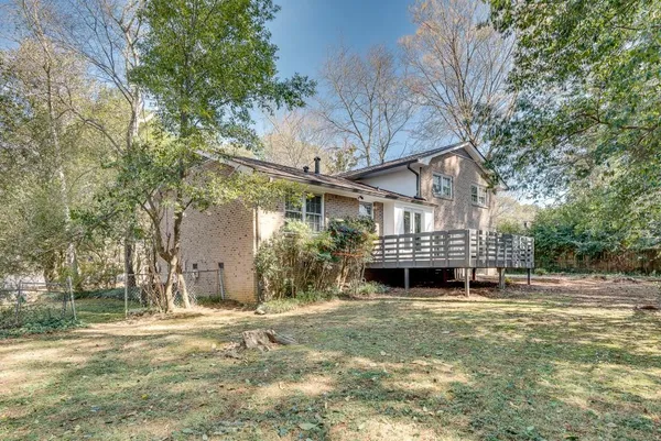 a picture of a bench in front of a wall