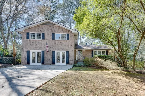 a front view of a house with a yard