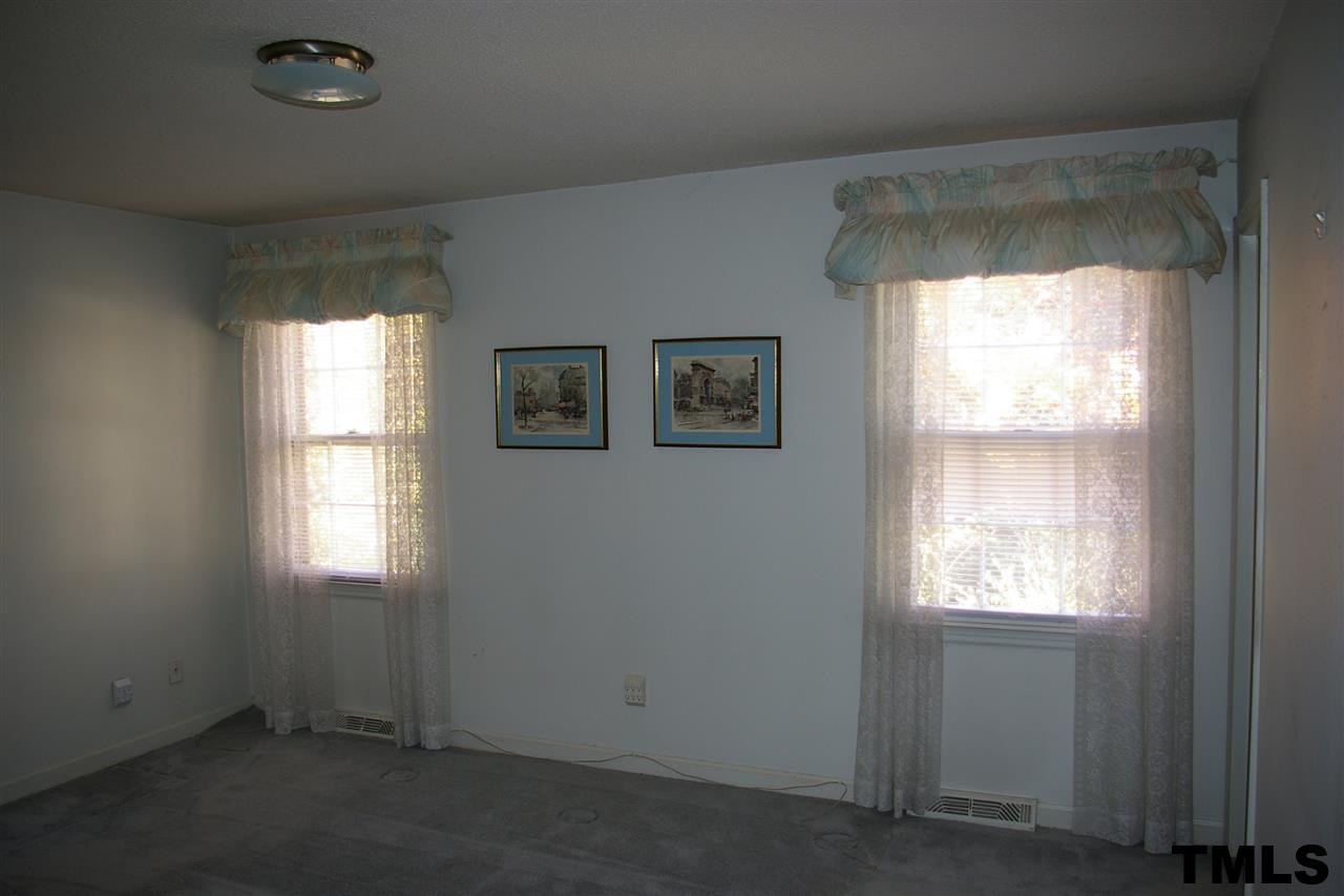 2609 Wycliff Road Raleigh, NC 27607 - Photo 6 of 14 an empty room that has a window