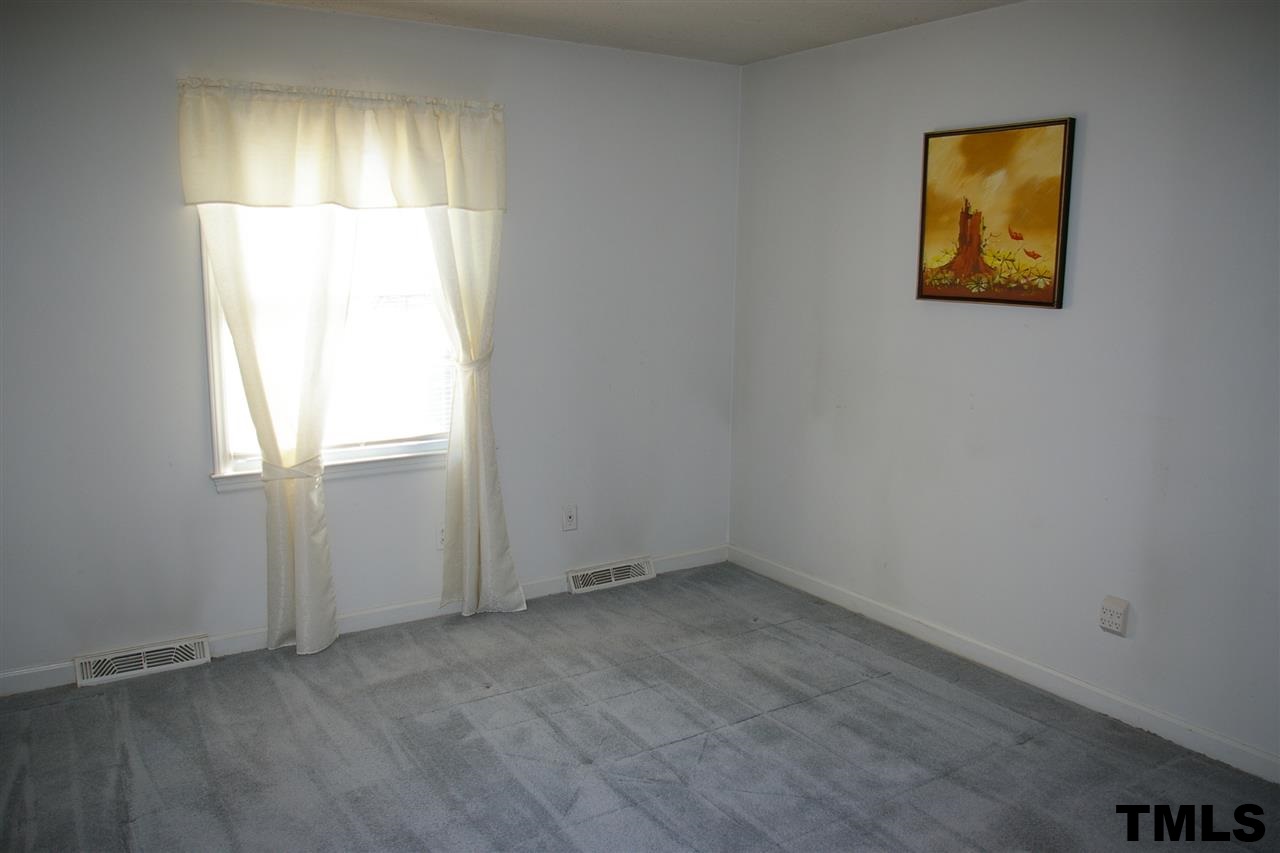2609 Wycliff Road Raleigh, NC 27607 - Photo 8 of 14 an empty room with a window