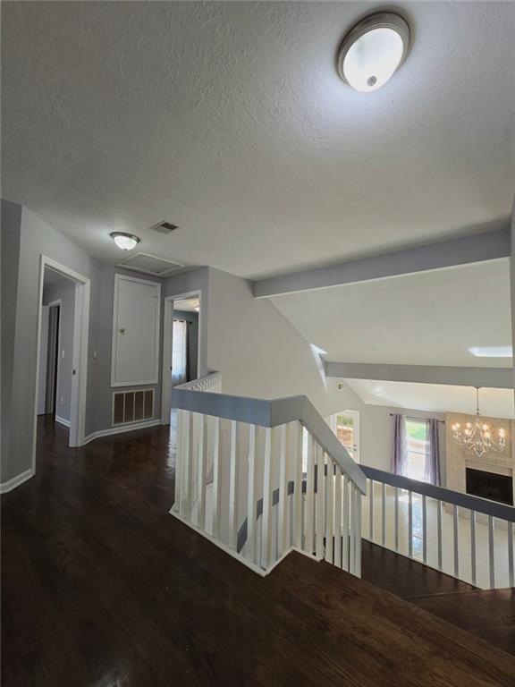 6992 Ivy Pointe Row Austell, GA 30168 - Photo 21 of 32 a view of a hallway with wooden floor