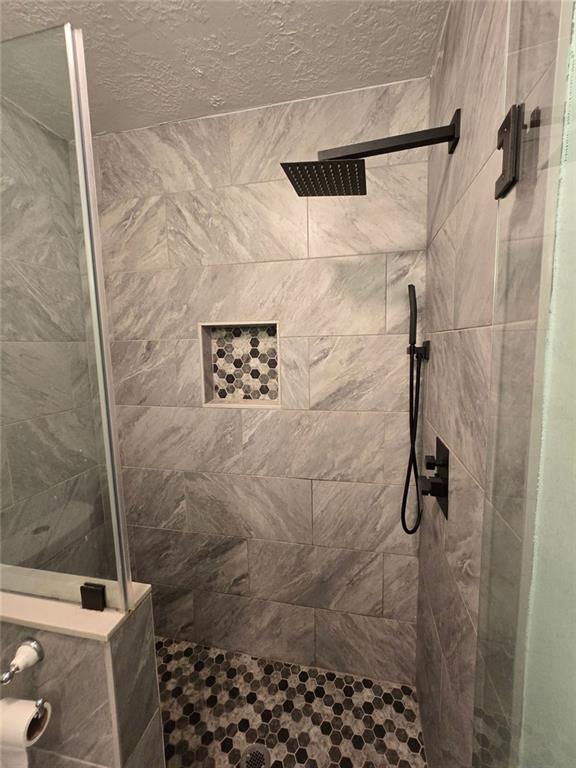 6992 Ivy Pointe Row Austell, GA 30168 - Photo 24 of 32 a bathroom with a shower