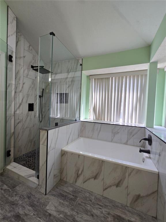 6992 Ivy Pointe Row Austell, GA 30168 - Photo 30 of 32 a spacious bathroom with a bathtub and a shower