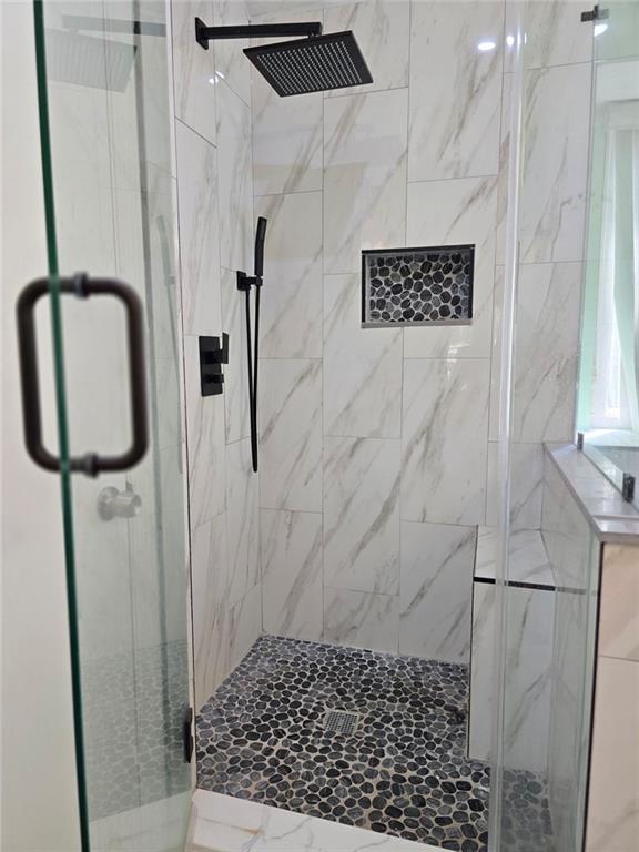 6992 Ivy Pointe Row Austell, GA 30168 - Photo 31 of 32 a bathroom with a shower