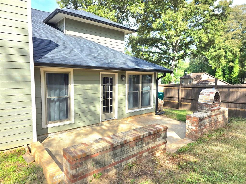 6992 Ivy Pointe Row Austell, GA 30168 - Photo 4 of 32 a view of house with yard outdoor seating area and barbeque oven