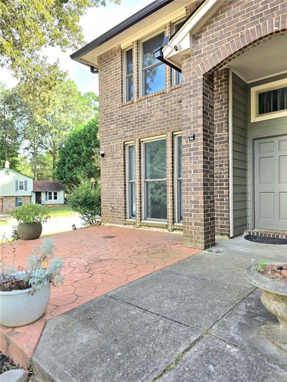 6992 Ivy Pointe Row Austell, GA 30168 - Photo 8 of 32 a backyard of a house with outdoor seating